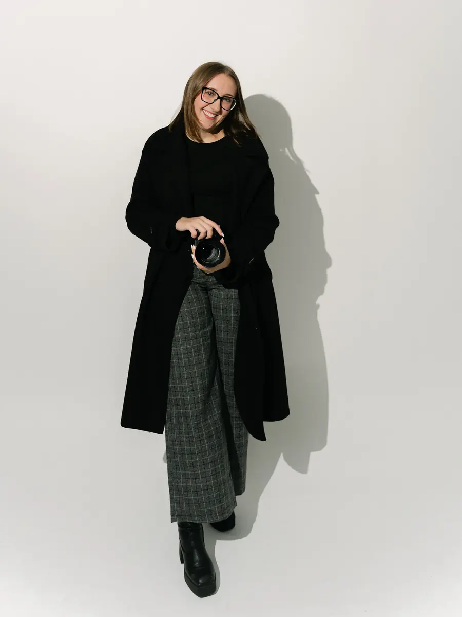 Faith, holding her camera